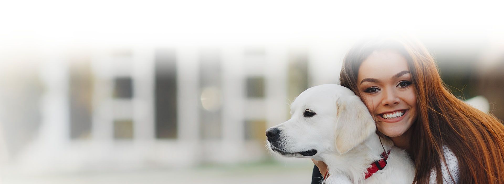 happy woman with white dog outdoor
